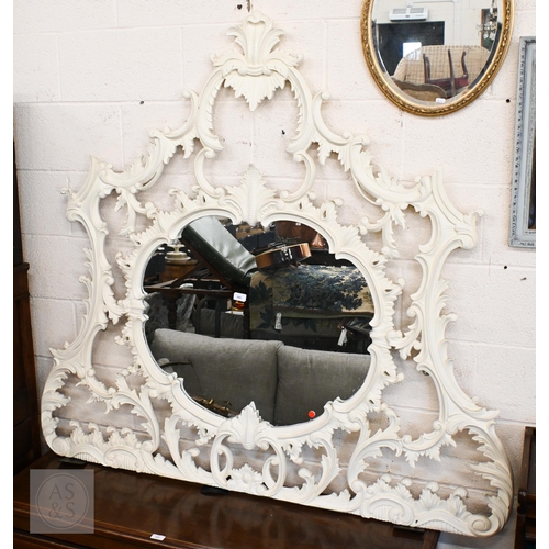 284 - A large Chippendale style painted over mantel mirror with scrolling foliate open frame, 260 x 145 cm... 