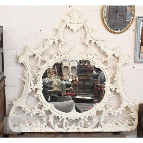 284 - A large Chippendale style painted over mantel mirror with scrolling foliate open frame, 260 x 145 cm... 