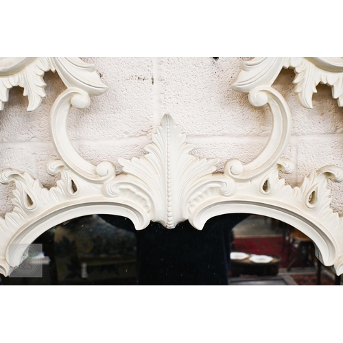 284 - A large Chippendale style painted over mantel mirror with scrolling foliate open frame, 260 x 145 cm... 