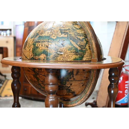 290 - A vintage hardwood globe drinks cabinet with half hinged top enclosing fitted interior