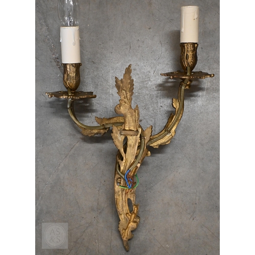 294 - A set of four gilt metal Rococo style twin branch wall lights