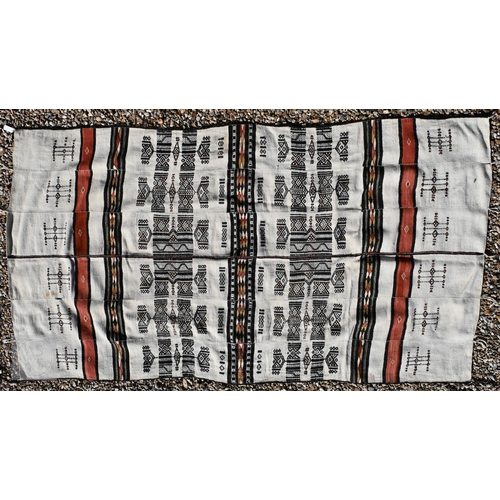 62 - A Pakistani Turkoman design rug with repeat gul design on red ground, to/w a Ghanaian blanket, 244 x... 