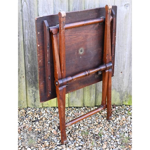 142 - An antique mahogany coaching table on folding base top, 75 x 60 cm