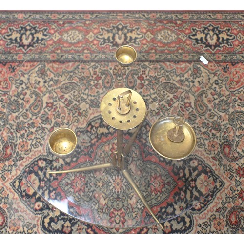 176 - An Italian glass top coffee table with brass fittings, Arteluce, 50 cm dia x 55 cm h