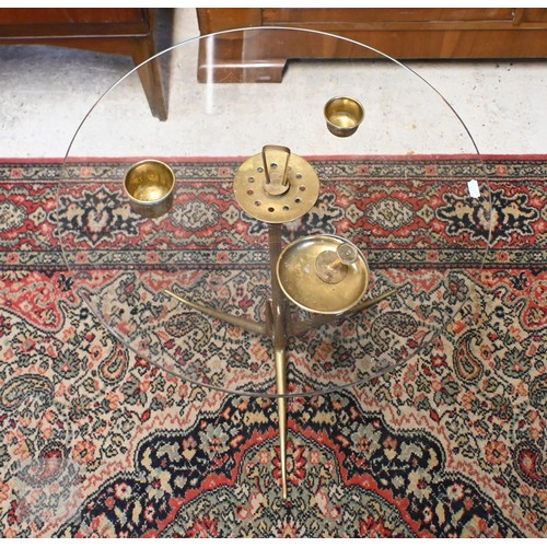 176 - An Italian glass top coffee table with brass fittings, Arteluce, 50 cm dia x 55 cm h