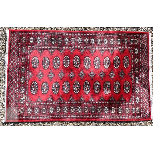 645 - Three old Turk/Afghan rugs, red ground, sizes 183 cm x 106 cm; 188 cm x 125 cm; 158 cm x 99 cm (3)
