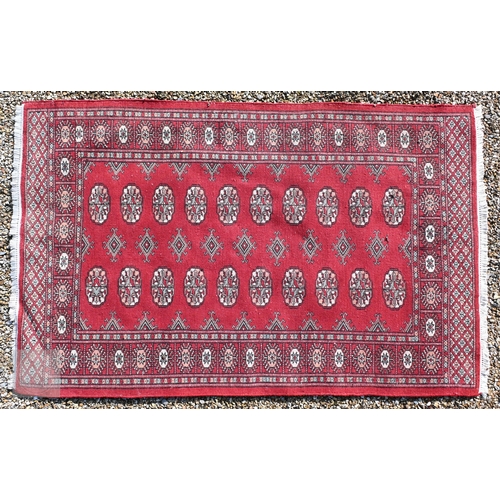 645 - Three old Turk/Afghan rugs, red ground, sizes 183 cm x 106 cm; 188 cm x 125 cm; 158 cm x 99 cm (3)