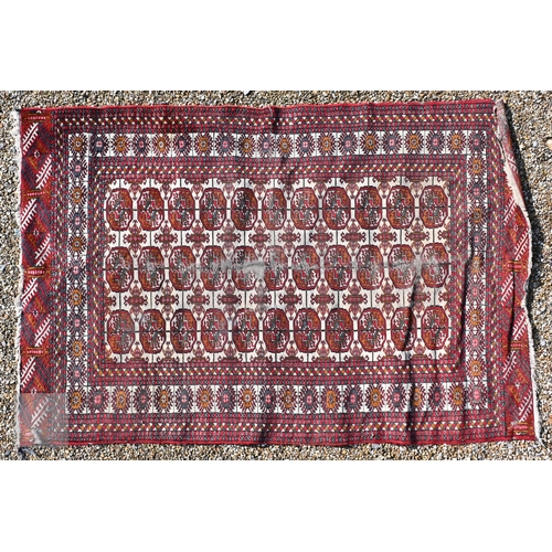 645 - Three old Turk/Afghan rugs, red ground, sizes 183 cm x 106 cm; 188 cm x 125 cm; 158 cm x 99 cm (3)