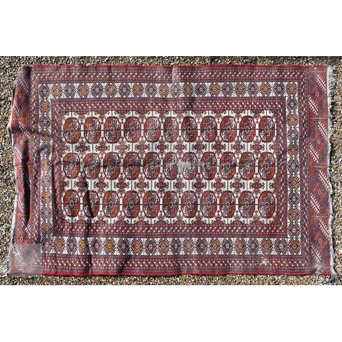 645 - Three old Turk/Afghan rugs, red ground, sizes 183 cm x 106 cm; 188 cm x 125 cm; 158 cm x 99 cm (3)