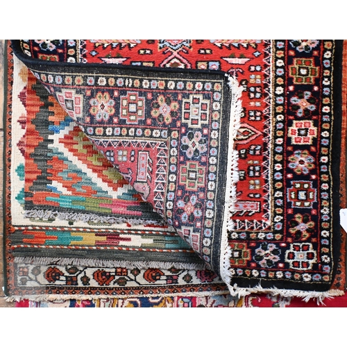 651 - A contemporary handmade Persian Karaja runner, the geometric pole design on red ground, 397 cm x cm ... 