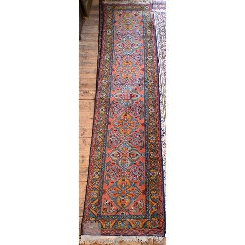 657 - A contemporary handmade Caucasian runner, the burnt orange ground with stylised floral pole design, ... 