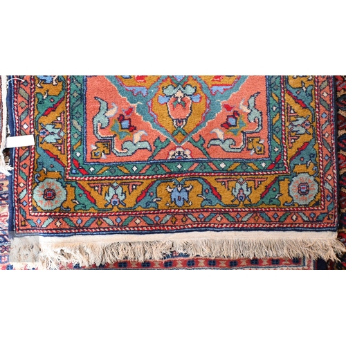 657 - A contemporary handmade Caucasian runner, the burnt orange ground with stylised floral pole design, ... 