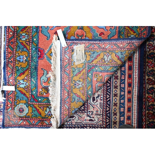657 - A contemporary handmade Caucasian runner, the burnt orange ground with stylised floral pole design, ... 