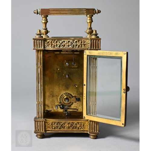 668 - A French brass five window carriage clock, with gothic revival style relief cast panels, the circula... 
