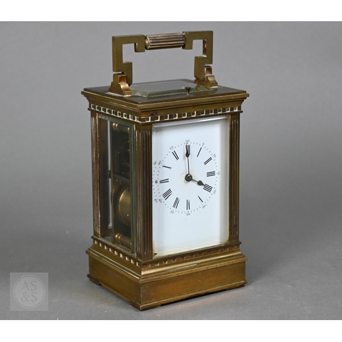 671 - A late 19th century brass cased twin train repeating movement carriage clock, striking the hours and... 