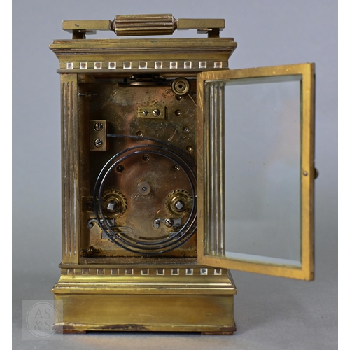 671 - A late 19th century brass cased twin train repeating movement carriage clock, striking the hours and... 