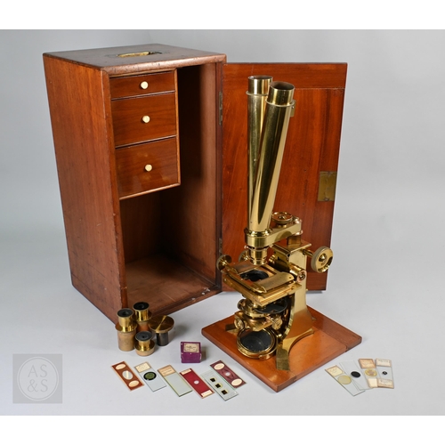 833 - A large antique lacquered brass binocular microscope by Baker, 24 High Holborn, London, in fitted te...