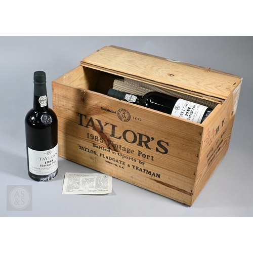 860 - Eleven bottles 1985 vintage Taylors Port, in original wooden case No warranty offered as to conditio... 