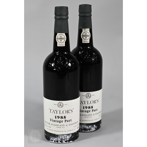 860 - Eleven bottles 1985 vintage Taylors Port, in original wooden case No warranty offered as to conditio... 
