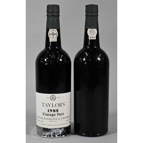 860 - Eleven bottles 1985 vintage Taylors Port, in original wooden case No warranty offered as to conditio... 