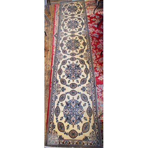 655 - A fine handmade Persian Nain runner, the camel ground with floral pole design, 436 cm x 89 cm