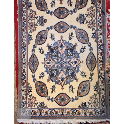 655 - A fine handmade Persian Nain runner, the camel ground with floral pole design, 436 cm x 89 cm