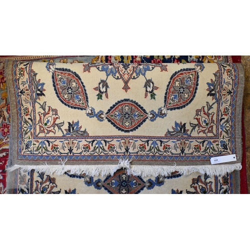 655 - A fine handmade Persian Nain runner, the camel ground with floral pole design, 436 cm x 89 cm