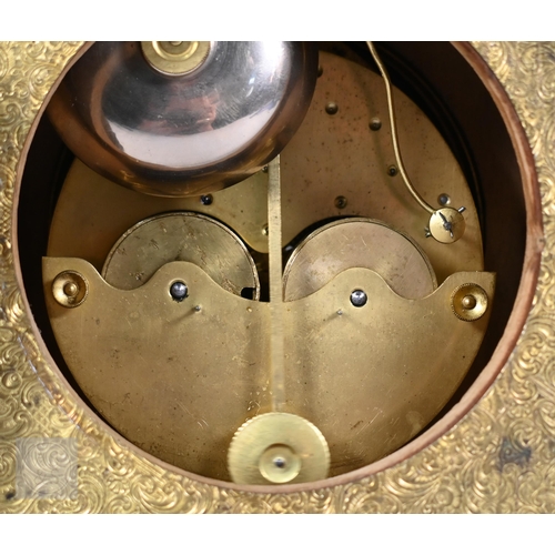 677 - A Continental profusely-chased brass mantel clock, the 8-day two train movement striking the hours a... 