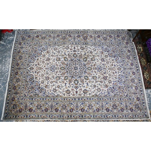 635 - A Central Persian Kashan carpet, cream ground with traditional floral design, 340 x 250 cm