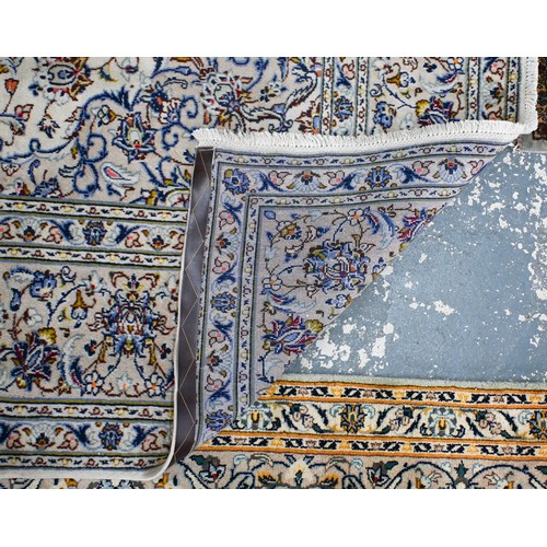 635 - A Central Persian Kashan carpet, cream ground with traditional floral design, 340 x 250 cm