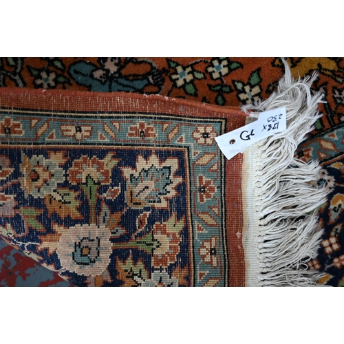 594 - A Persian Quom rug, mid 20th century, the brown-gold ground with pictorial hunting scenes intertwine... 