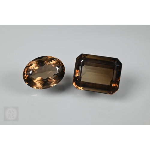 538 - Two loose brown citrine stones, one oval 2 x 1.5 cm, one rectangular 2.2 x 1.8 cm, a pair of pale br... 