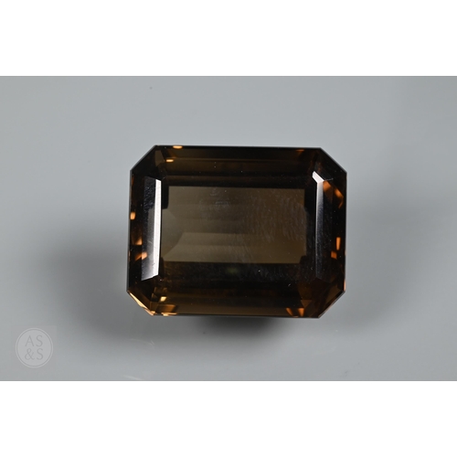 538 - Two loose brown citrine stones, one oval 2 x 1.5 cm, one rectangular 2.2 x 1.8 cm, a pair of pale br... 