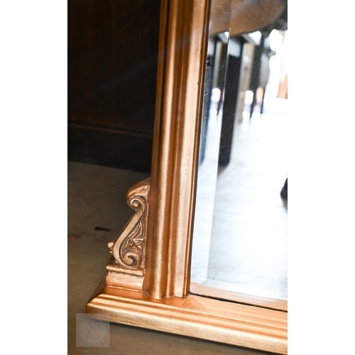 182 - A modern arched overmantel mirror with bevelled glass and moulded gilt frame, 104 x 82 cm