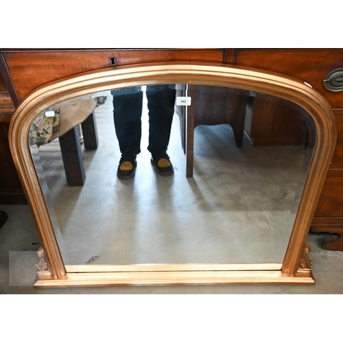 182 - A modern arched overmantel mirror with bevelled glass and moulded gilt frame, 104 x 82 cm