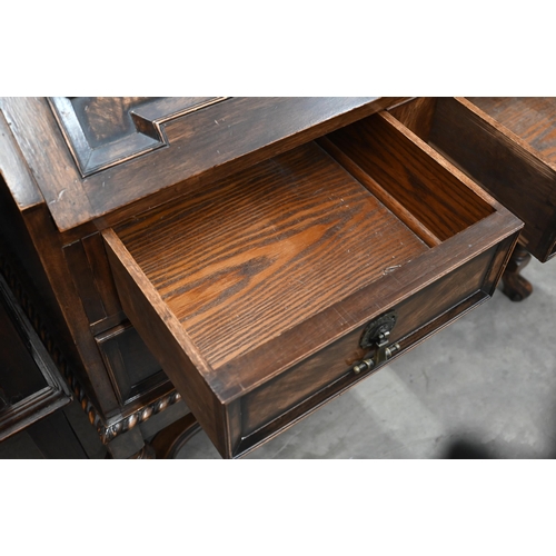 272 - A 17th century style mahogany and walnut bureau bookcase, astragal glazed doors over the fall front ... 