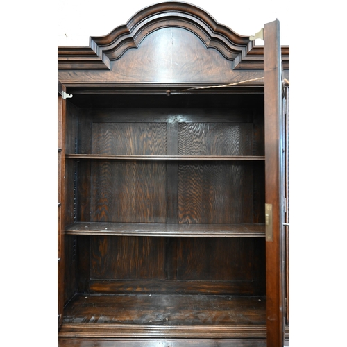 272 - A 17th century style mahogany and walnut bureau bookcase, astragal glazed doors over the fall front ... 
