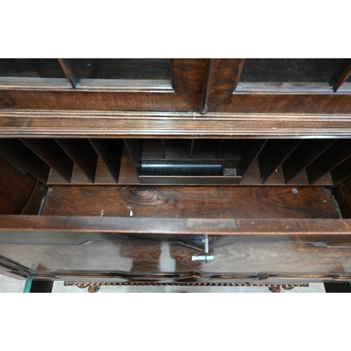 272 - A 17th century style mahogany and walnut bureau bookcase, astragal glazed doors over the fall front ... 