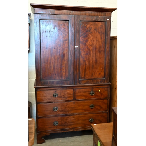 278 - A 19th century figured mahogany linen press (slides replaced by rail), with panelled doors over two ... 