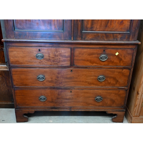 278 - A 19th century figured mahogany linen press (slides replaced by rail), with panelled doors over two ... 