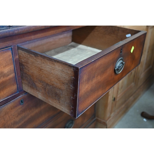 278 - A 19th century figured mahogany linen press (slides replaced by rail), with panelled doors over two ... 