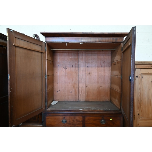 278 - A 19th century figured mahogany linen press (slides replaced by rail), with panelled doors over two ... 