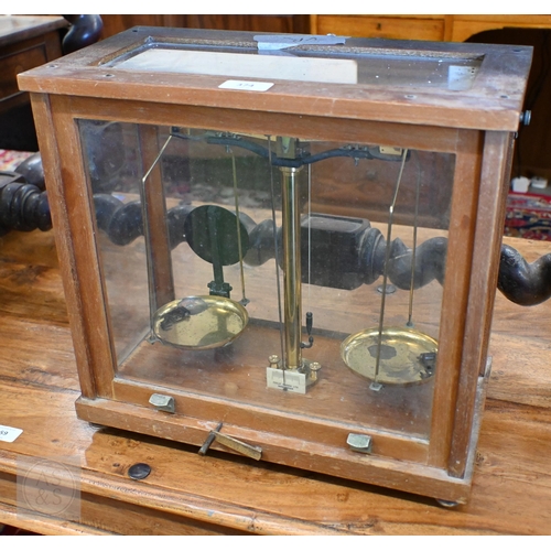 374 - #A vintage chemical balance in glazed case