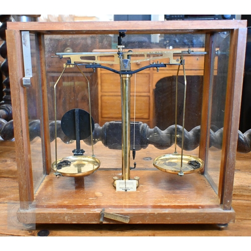 374 - #A vintage chemical balance in glazed case