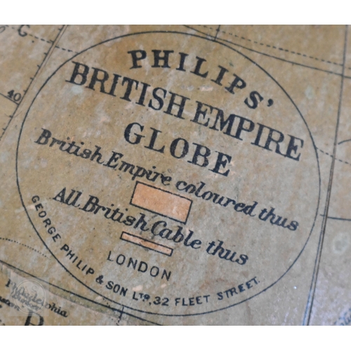 377 - A vintage Philips' British Empire Globe 19cm diam on metal and turned wood base, to/w a brass hand-b... 