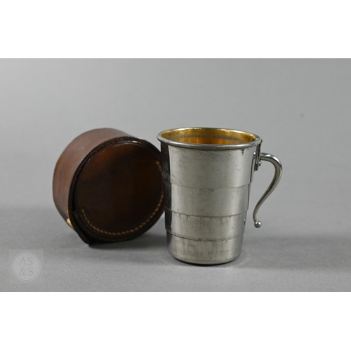 380 - An antique lacquered brass bearing compass in leather case, by Elliot Bros, London, to/w an ep colla... 