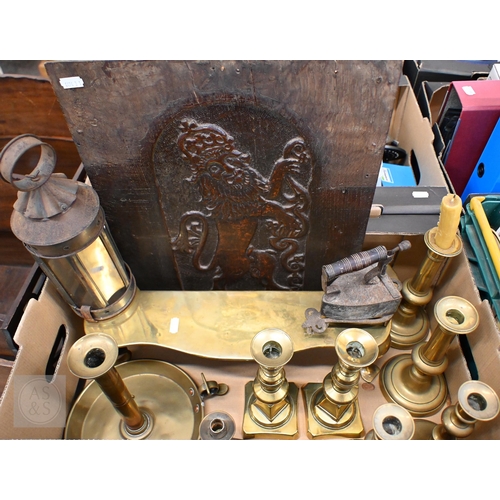 394 - A Victorian brass footman on cabriole supports and an antique oak panel carved with a heraldic Royal... 