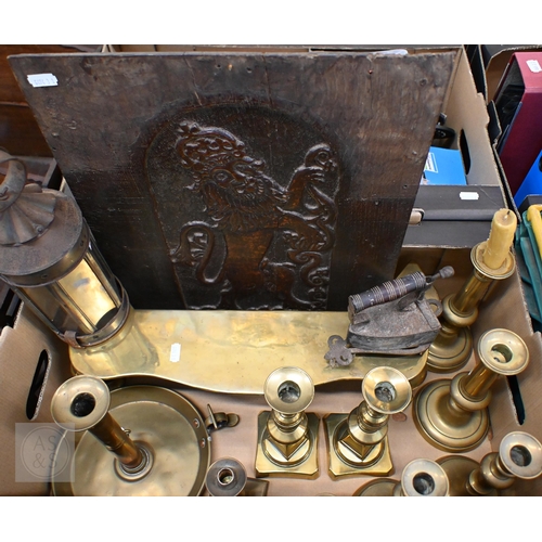 394 - A Victorian brass footman on cabriole supports and an antique oak panel carved with a heraldic Royal... 
