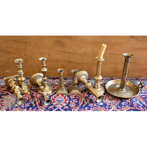 394 - A Victorian brass footman on cabriole supports and an antique oak panel carved with a heraldic Royal... 