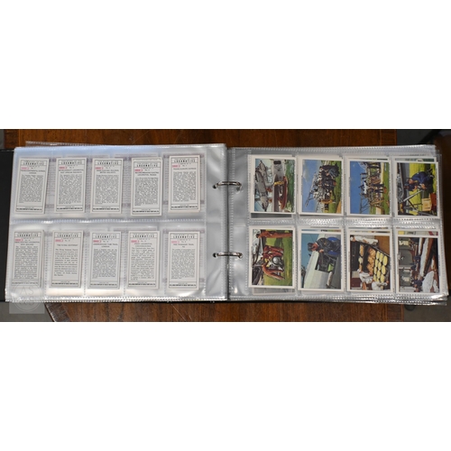 547 - A quantity of reproduction and some vintage cigarette cards - framed and in albums (box)